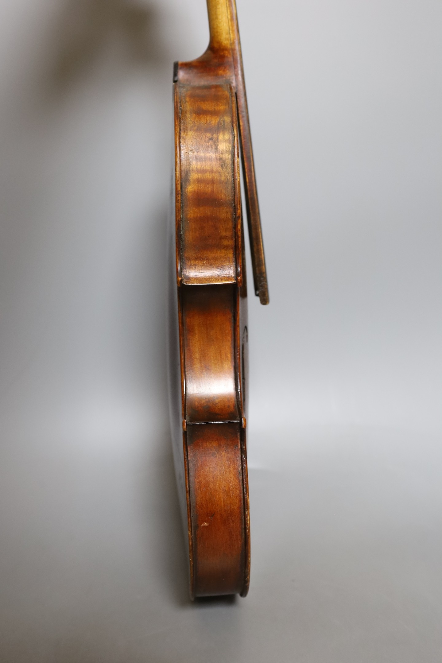 A European violin, circa 19th century, 59 cms long.